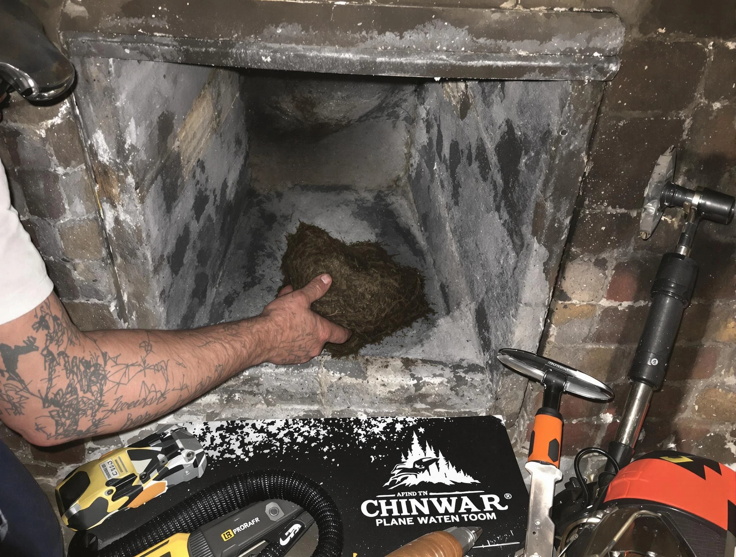White Bluff Chimney Sweep safely removing debris and screening chimney in White Bluff, TN